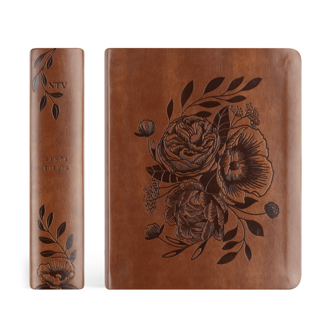 Brown leather book with floral embossing on a white background