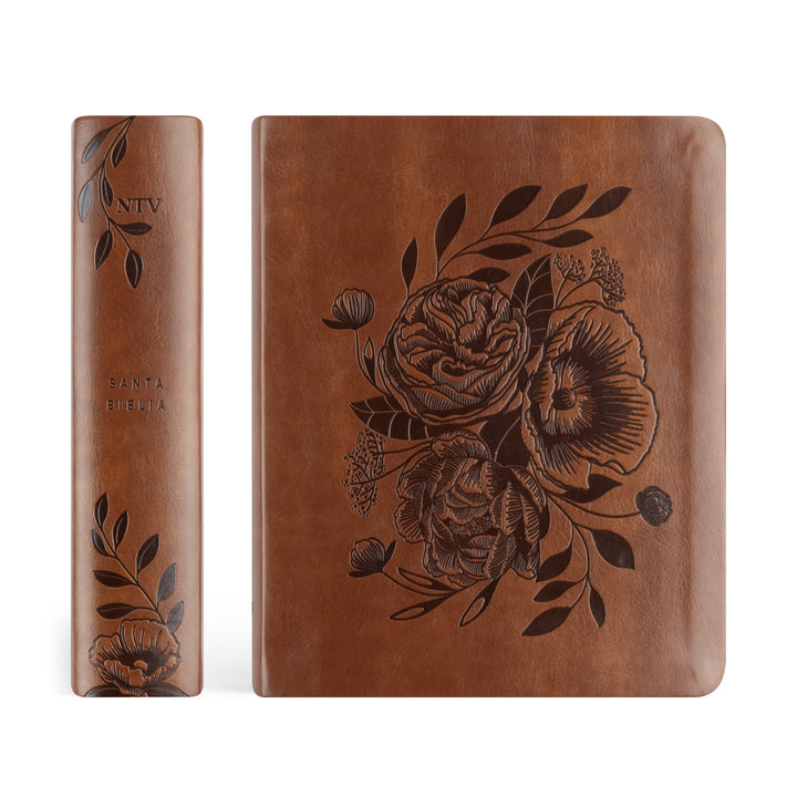 Brown leather book with floral embossing on a white background