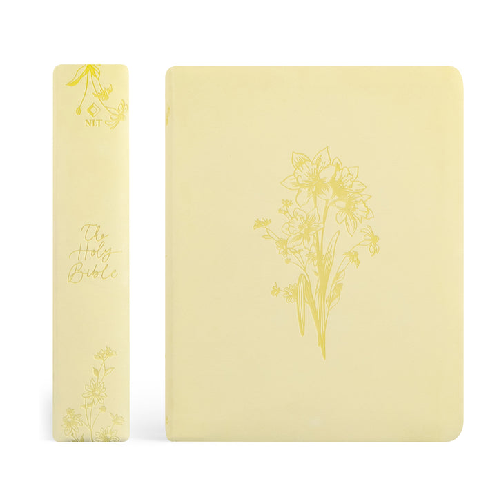 Bible with floral designs on a white background