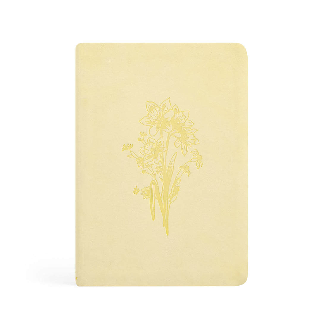 Yellow notebook with floral design on a white background