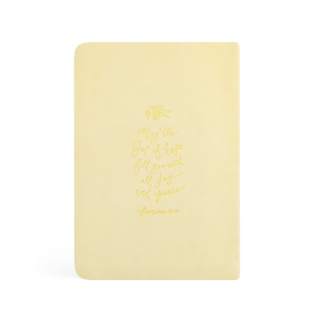 Yellow notebook with gold text on a white background