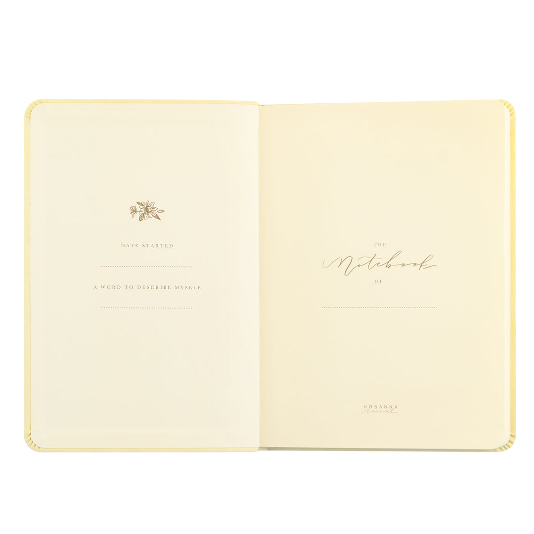Open notebook with decorative cover on a white background