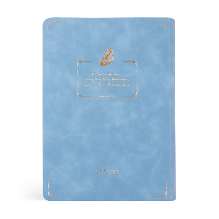 Blue Bible with gold text and design on a white background