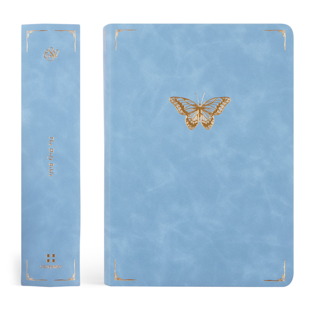 Blue Bible with a gold butterfly design on a white background