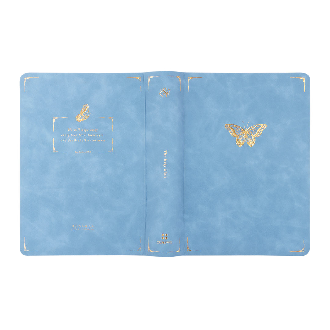 Blue Bible with gold butterfly design on a white background
