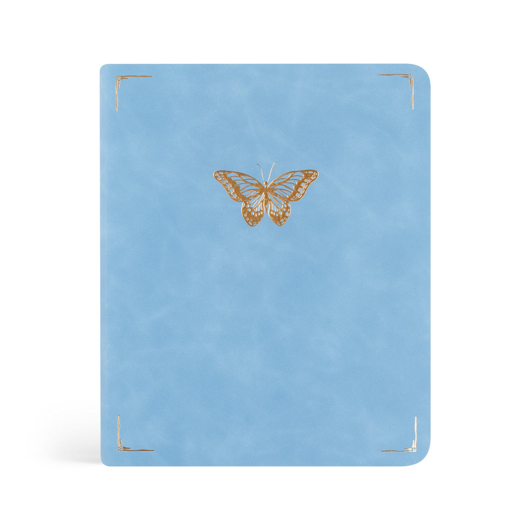 Blue notebook with a gold butterfly design on a white background