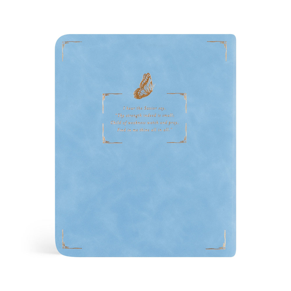 Light blue notebook with gold butterfly design and text on a white background