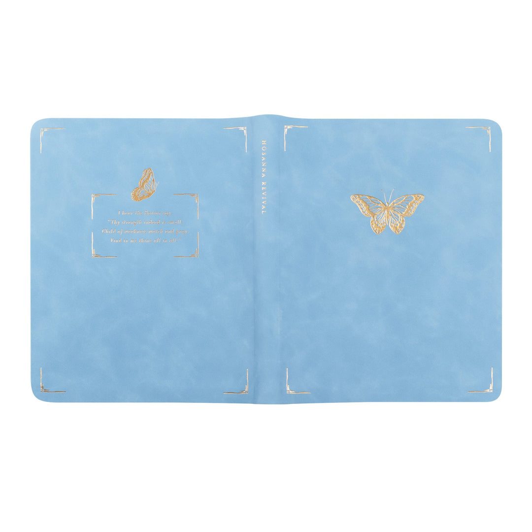 Light blue passport holder with gold butterfly designs on a white background