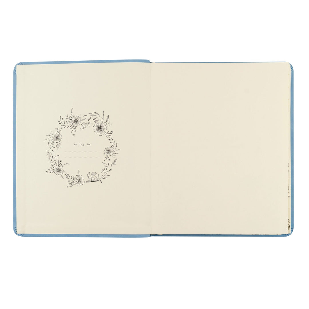 Notebook with floral wreath design on a white background