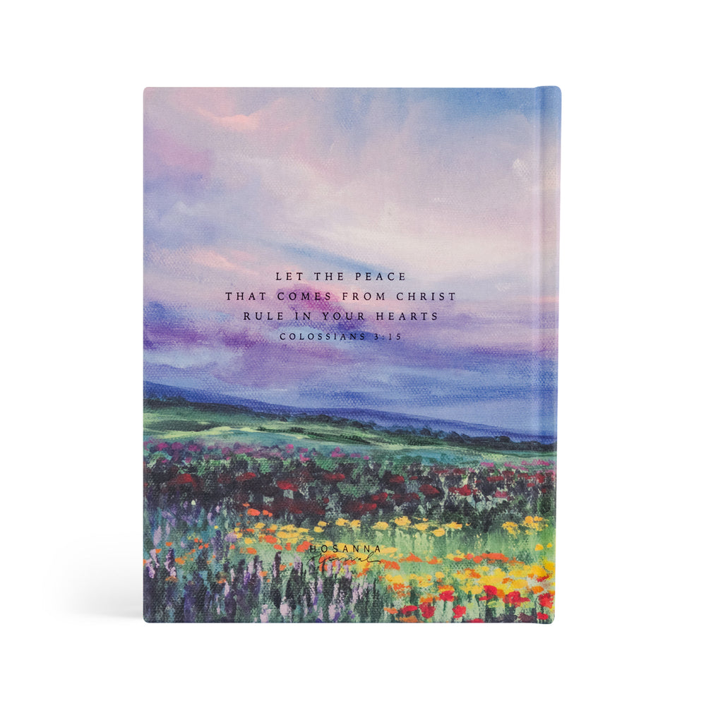 Bible with a colorful landscape design and inspirational quote on a white background