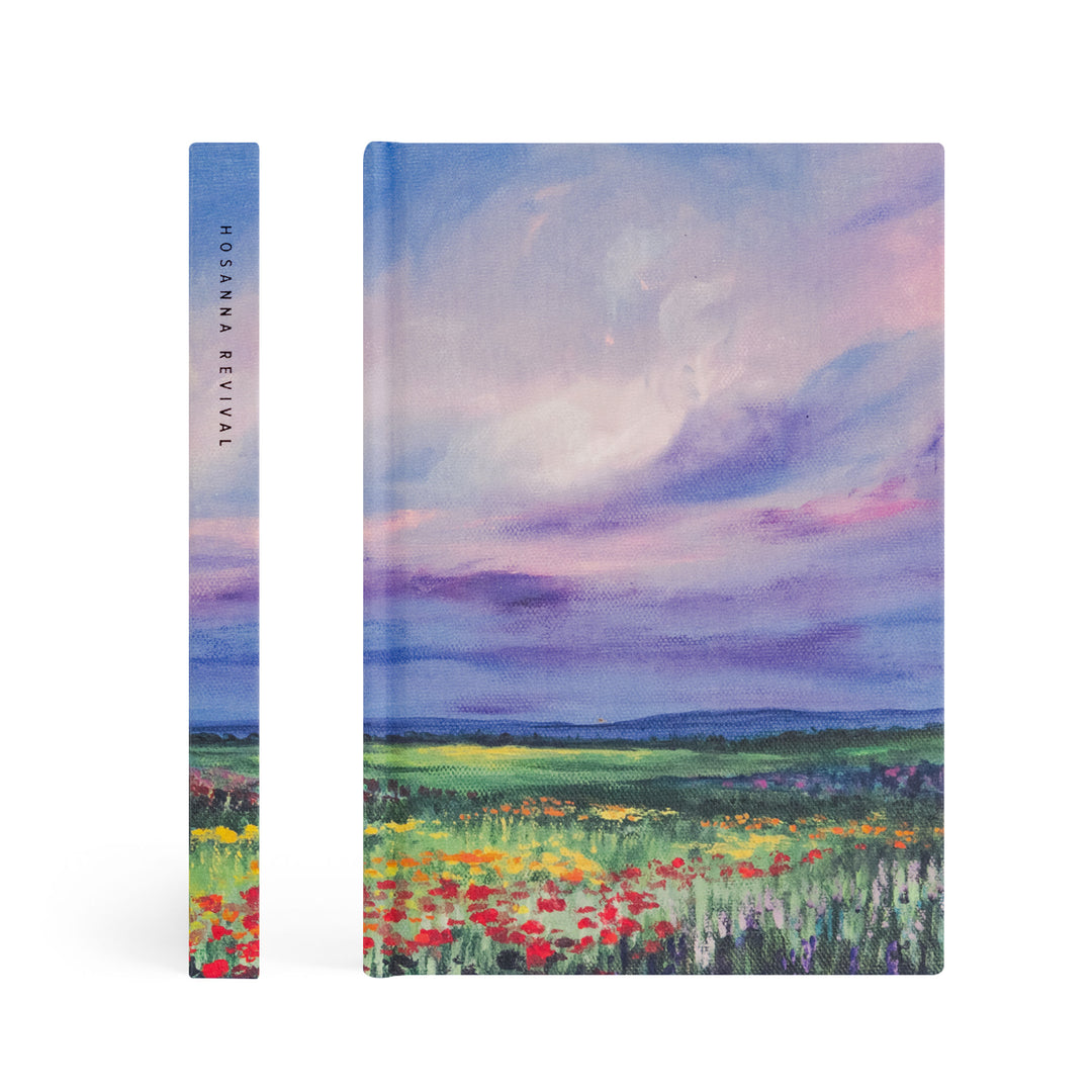 Notebook with a colorful landscape design on the cover