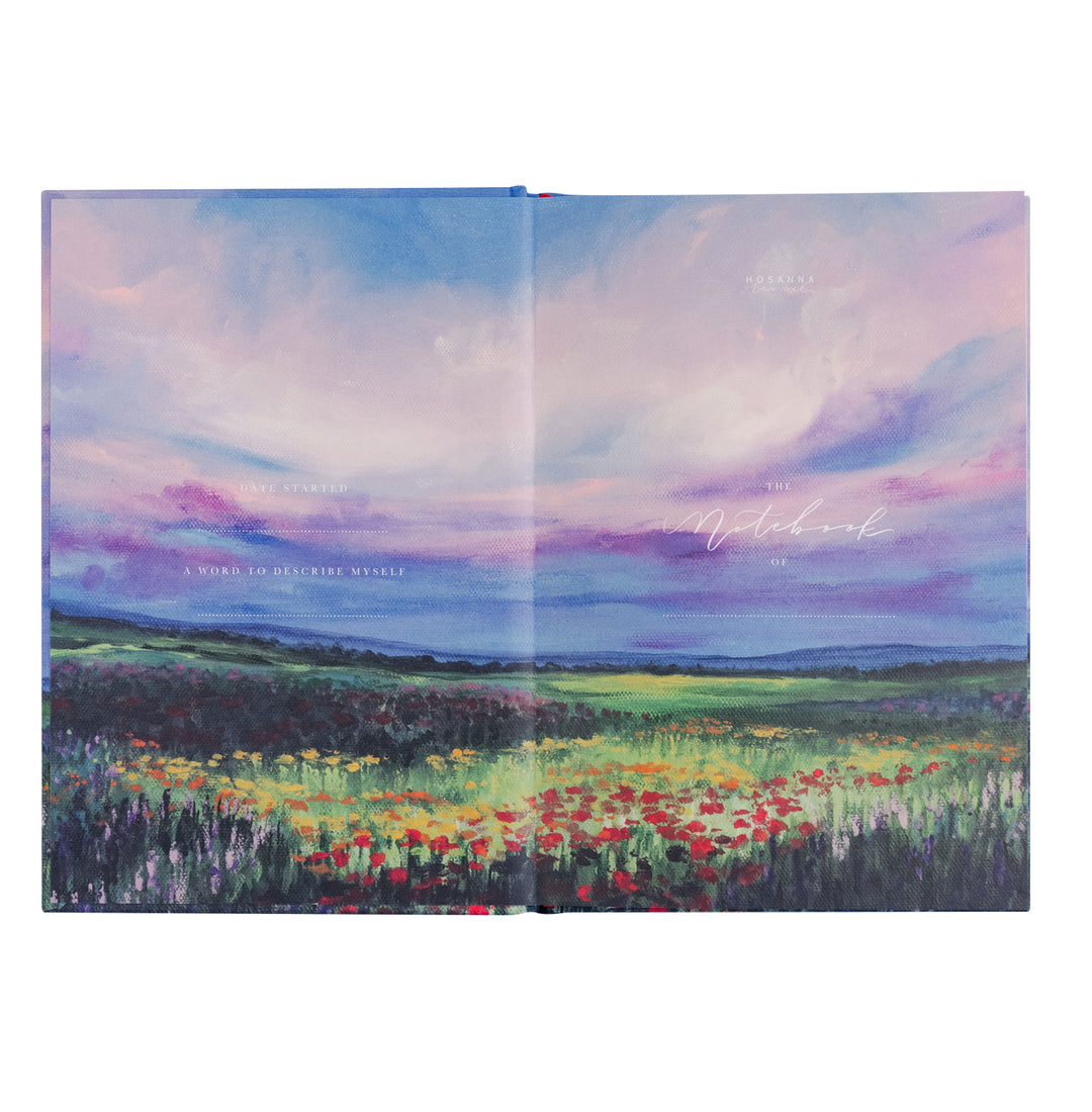 Notebook with a colorful landscape design on the cover