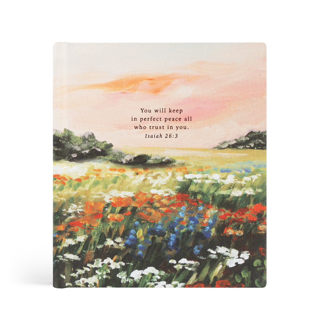 Notebook with a colorful landscape illustration and a Bible verse on a white background
