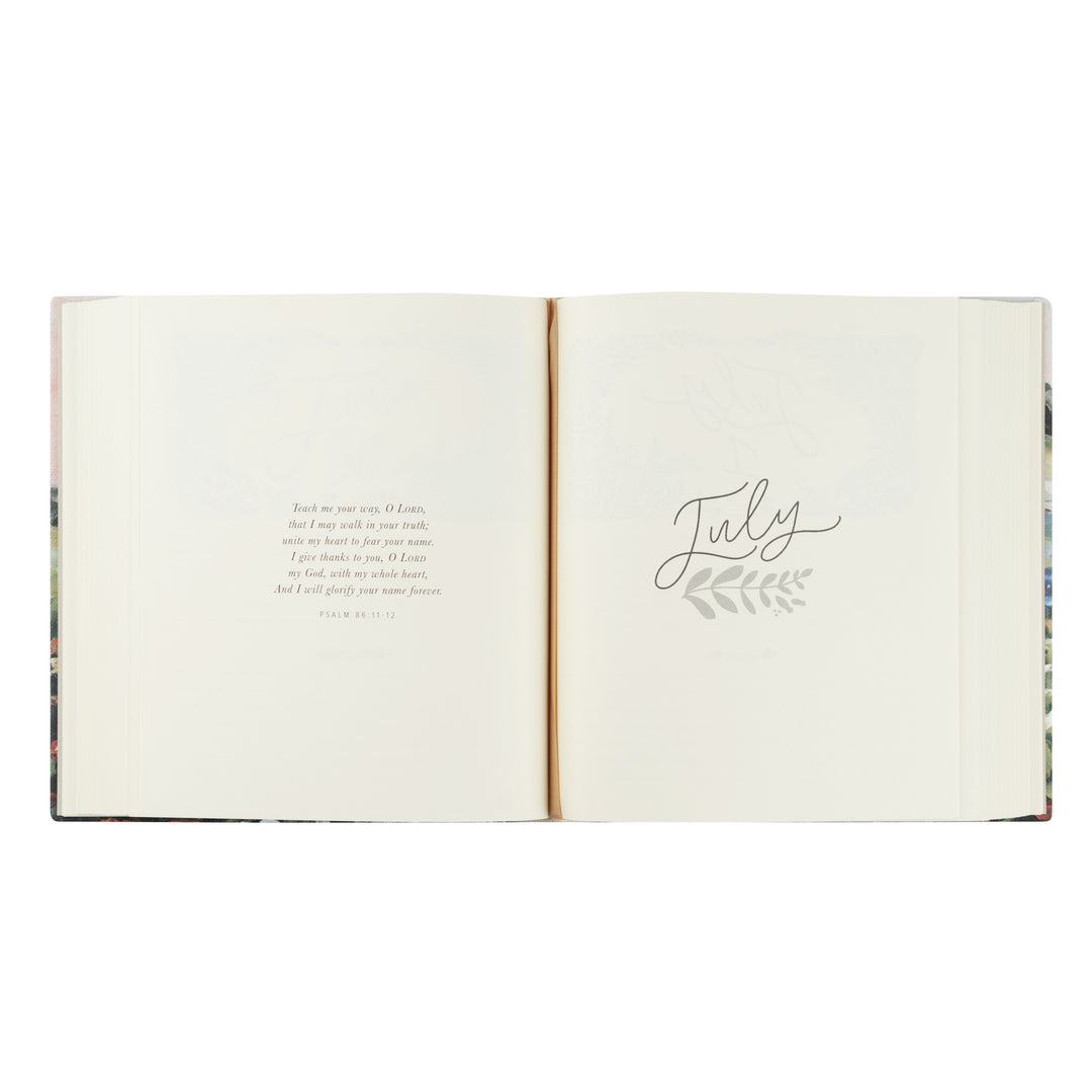 Open book with 'July' written on a white background