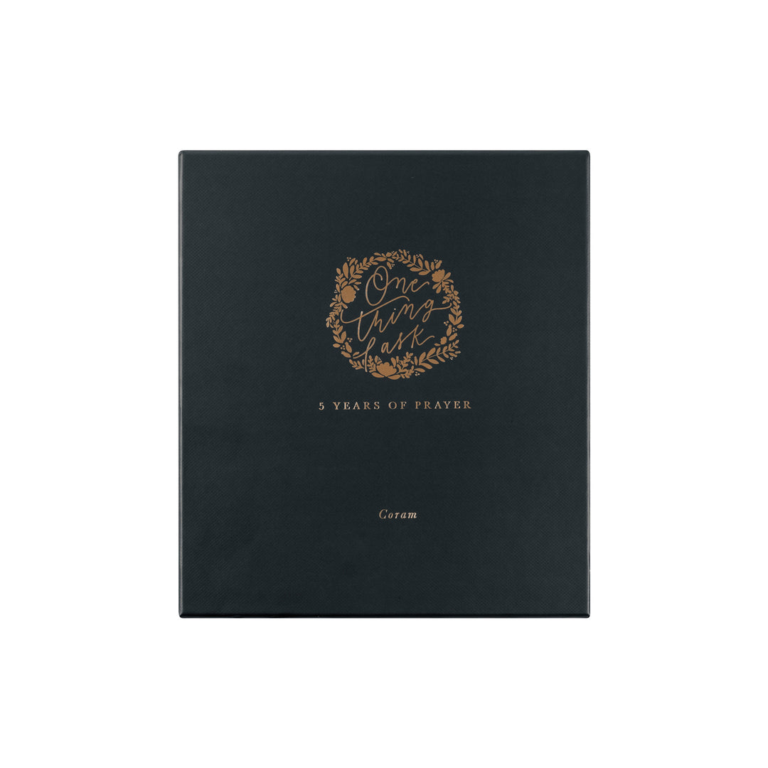 Black book with gold text and design on a white background