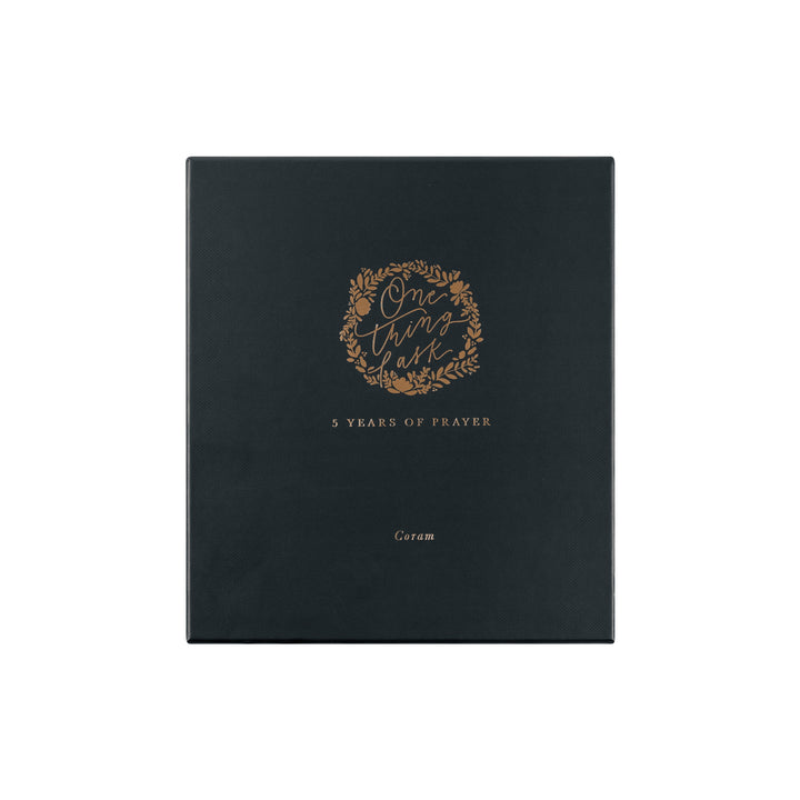 Black book with gold text and design on a white background