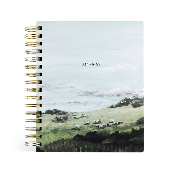 planner with a scenic cover featuring sheep in a field and the text 'Abide in Me'.