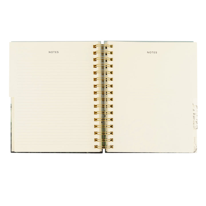 Open notebook with 'NOTES' label on each page, gold spiral binding