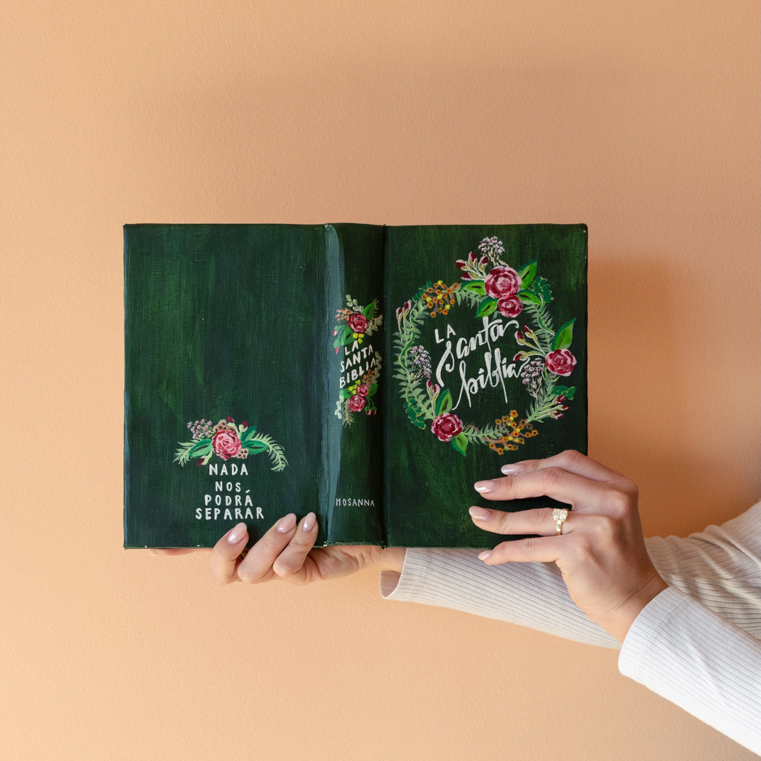 Hand painted Spanish Bible with green background and a floral wreath