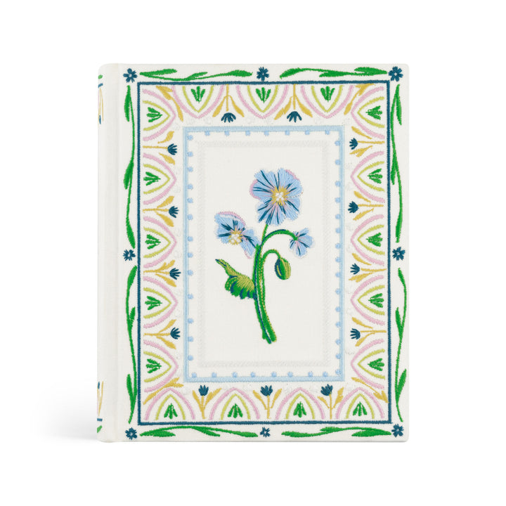 Decorative card with floral design and geometric border on a white background