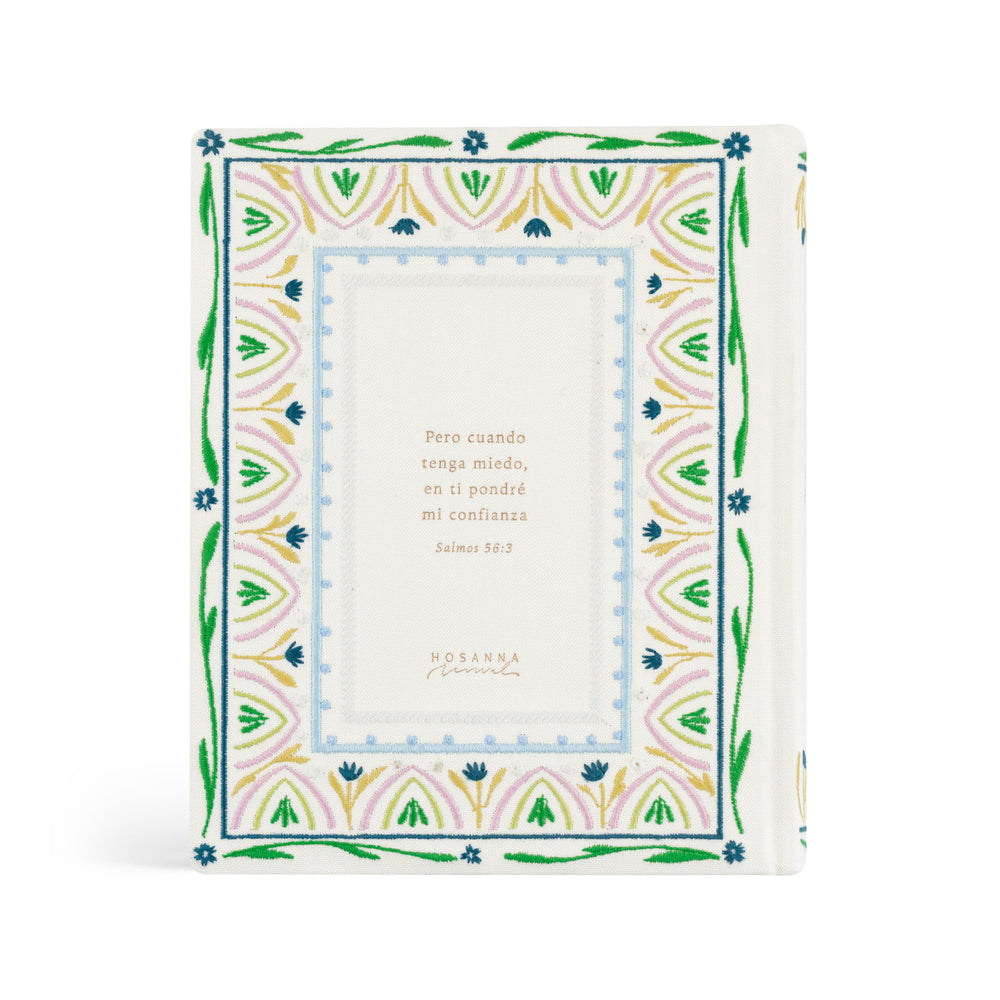 Decorative Bible with floral border and text on a white background