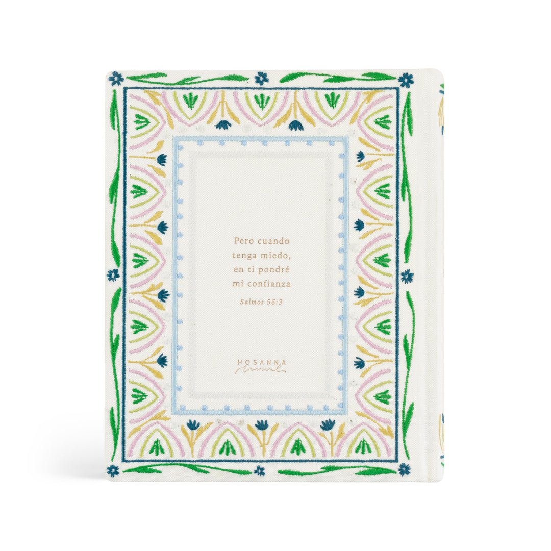 Decorative Bible with floral border and text on a white background