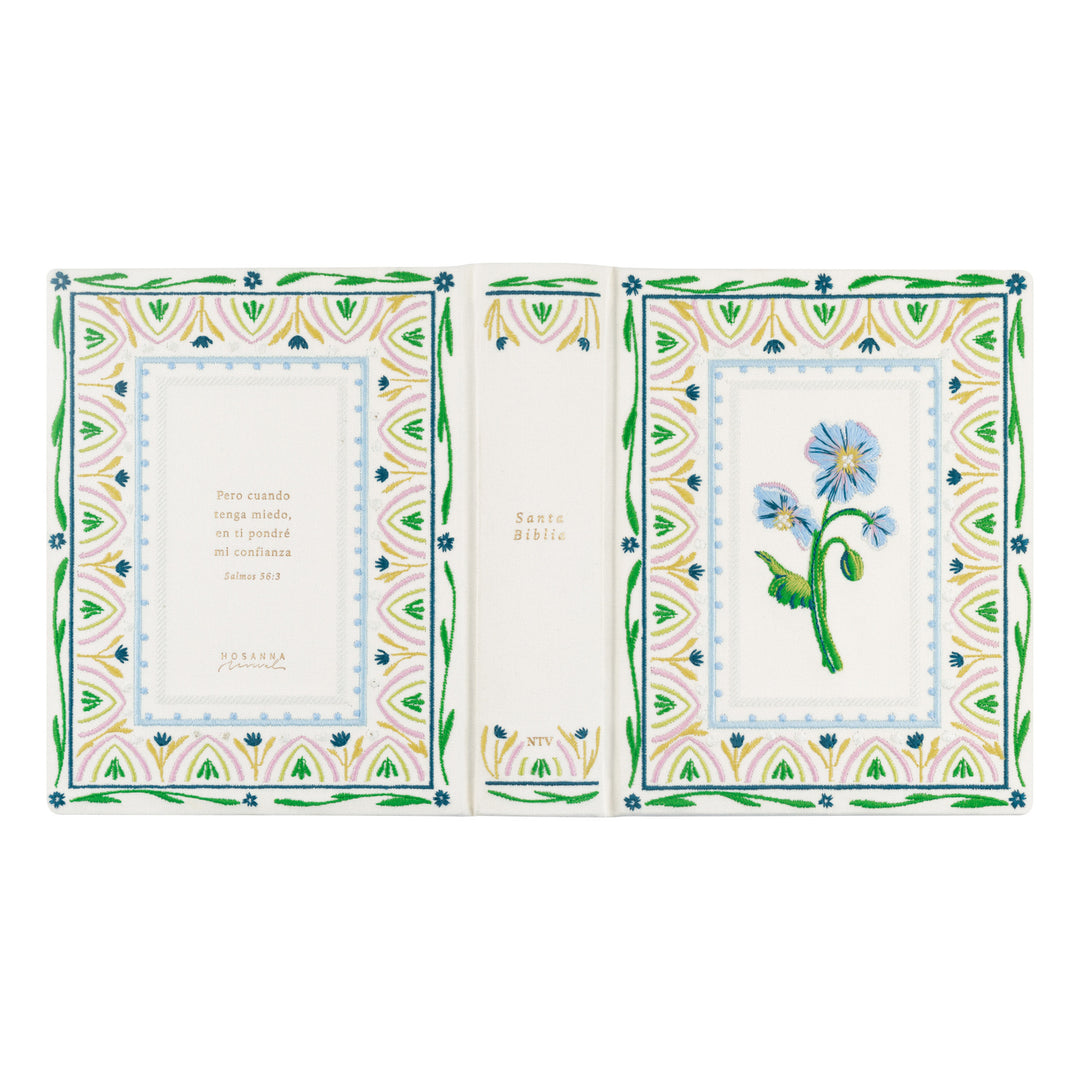 Decorative Bible with floral design and text on a white background