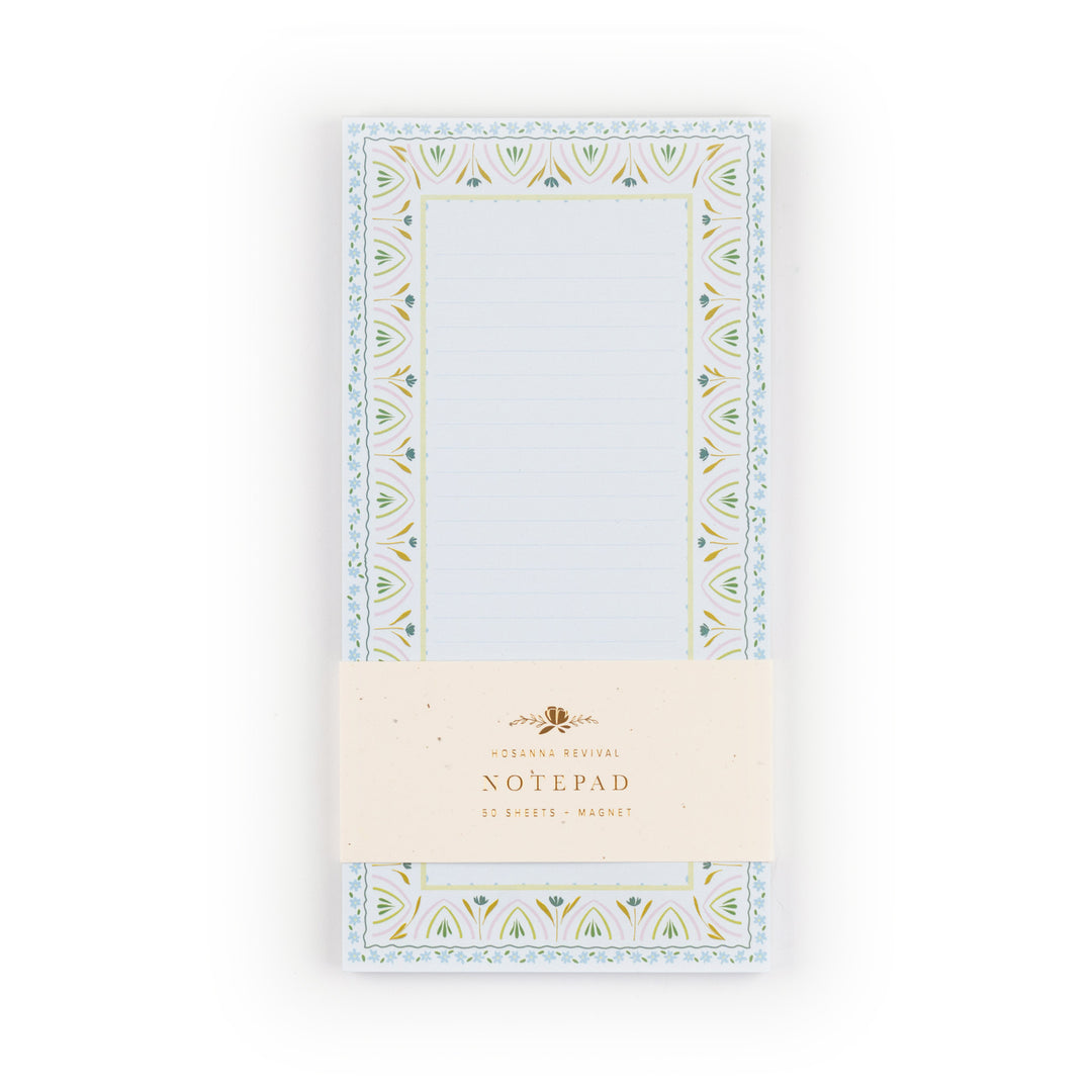 Notepad with decorative border on a white background