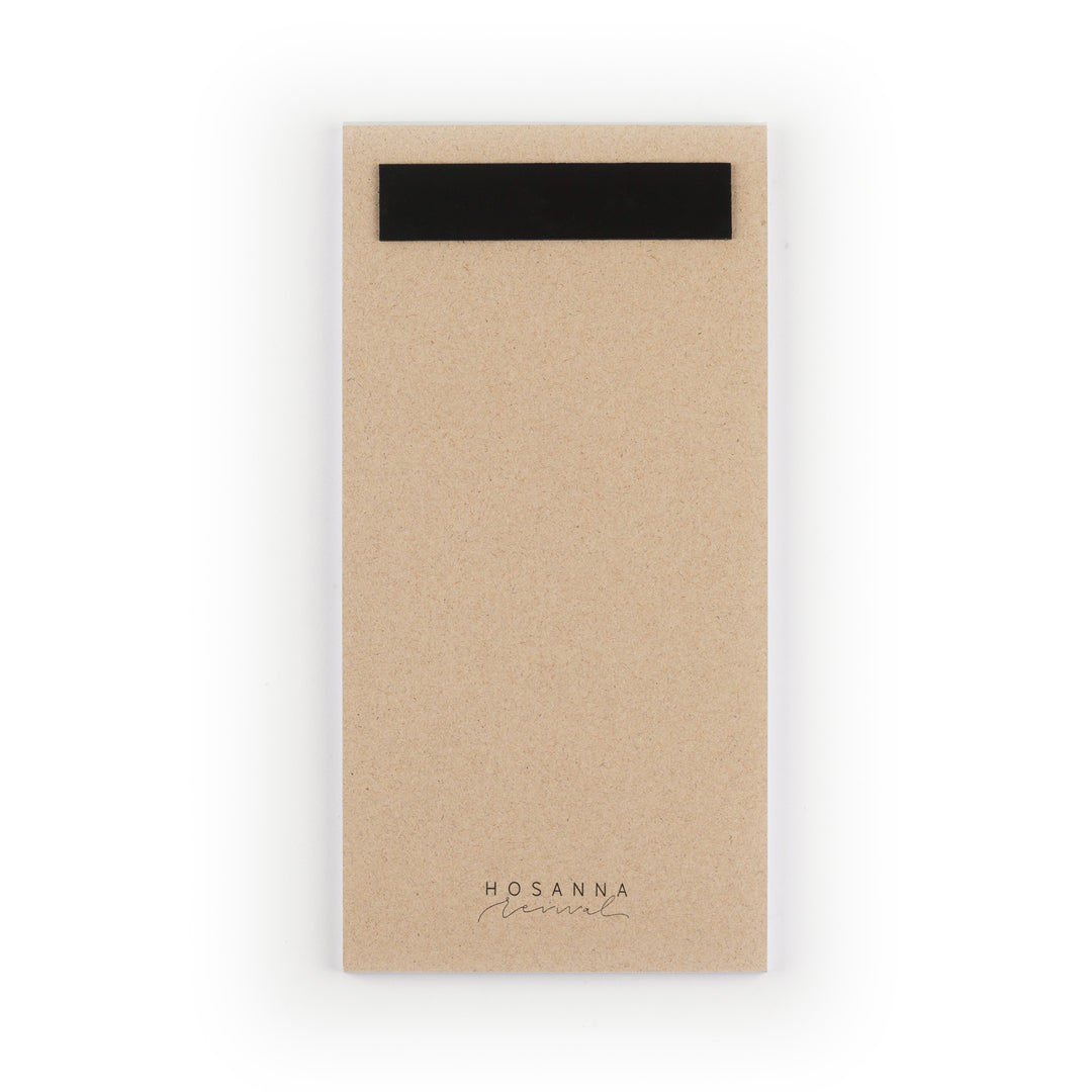 Kraft paper notepad with a black magnet strip on a white background