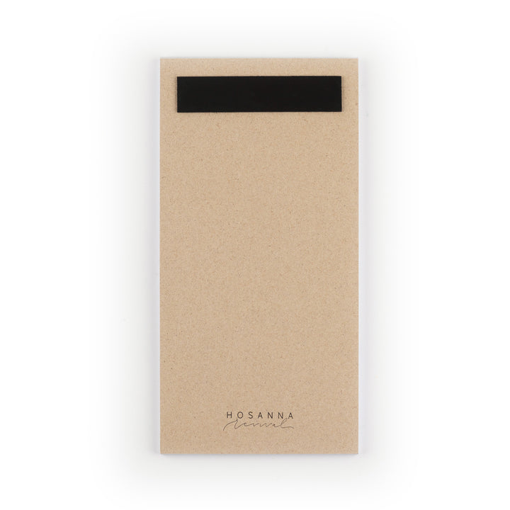 Kraft paper notepad with a black magnet strip on a white background