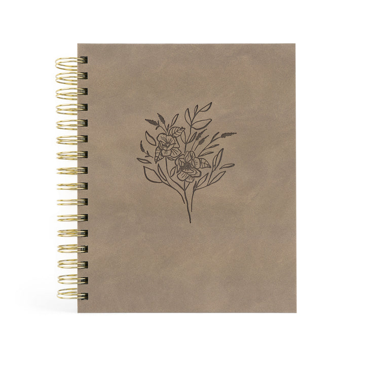 Brown planner with floral design on a white background