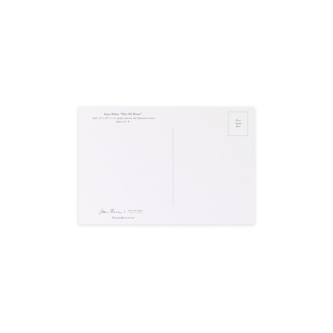 A white postcard with printed text on the front and a small address block on the back, shown against a plain white background.