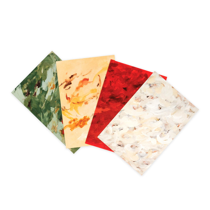 Four square patterned tiles or sheets fanned out on a white background, showing marbled designs in green, beige, red, and off-white.