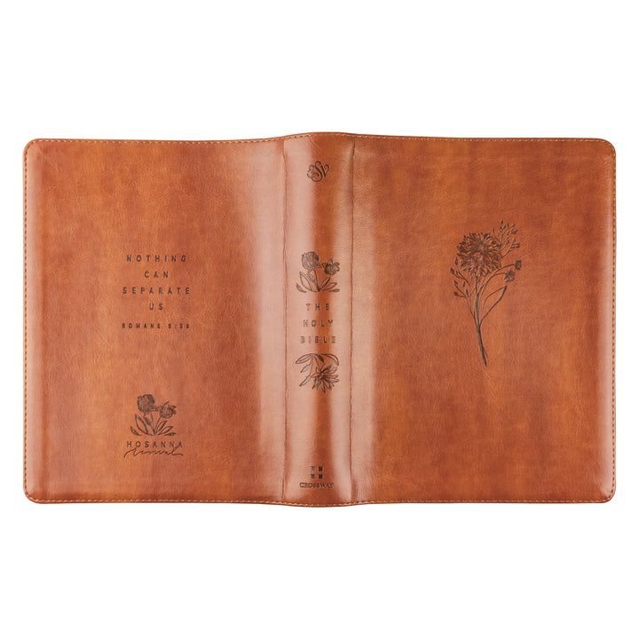 Brown leather notebook with floral embossing on a white background