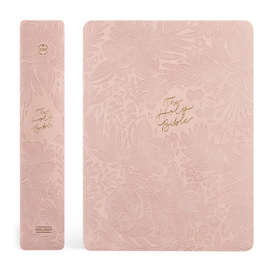Pink floral embossed Bible with gold text on a white background