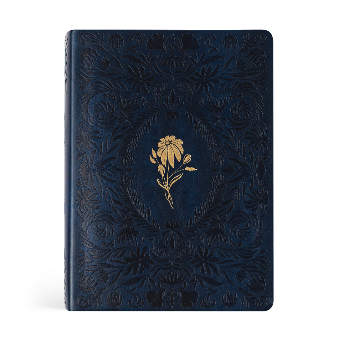 Blue Bible with floral embossing and gold flower design on a white background