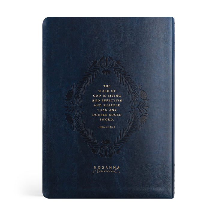 Navy blue leather-bound book with embossed text on a white background