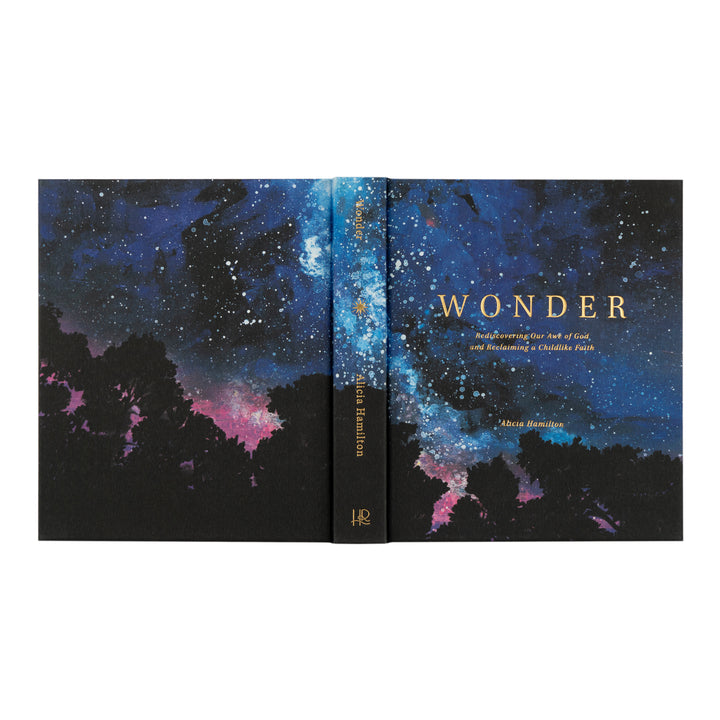 Book titled 'Wonder' with cosmic design on cover and spine