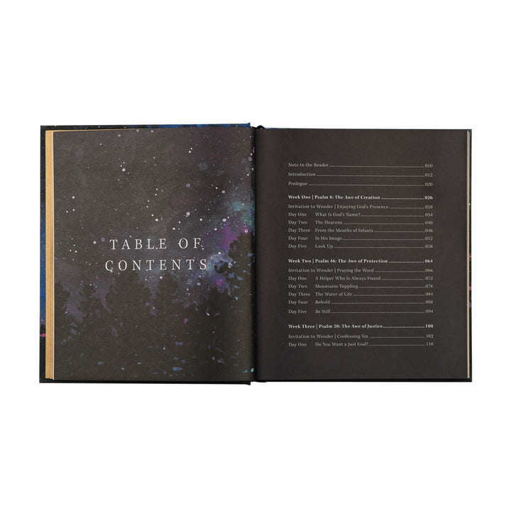 Open book showing a table of contents with a cosmic design on the left page.